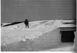 A home buried in snow